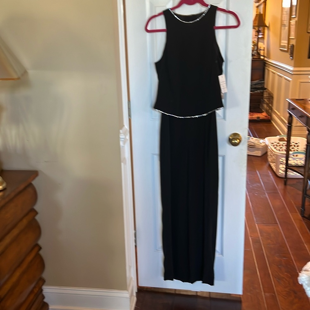 Great black jumpsuit. Never worn. Would be great for parties.  Really classy